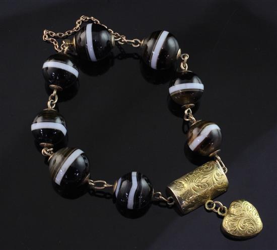 A Victorian gold, silver gilt and banded agate bead bracelet, approximately 6.5in.